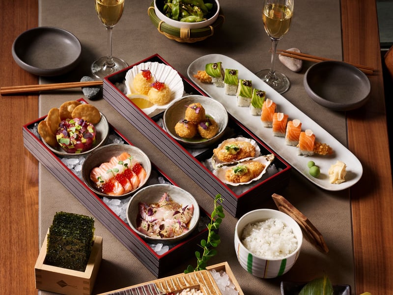 From the grill comes scallops wrapped in bacon, black cod and lamb with spring onions, alongside lighter salads and a raft of plant-based options. Generous set menus include: Set for Success delivering a signature feast of tempura favourites, premium rolls and standout tataki, while Mixed Emotions offers a playful mix of tataki, maki and sticks, ideal for one or more. For those who like things bold, the Robust set serves beef tataki, duck tsukune and yakitori. Kids’ get their own bento boxes while desserts include matcha fondant and goma, a vanilla crème brûlée with black sesame crumble.