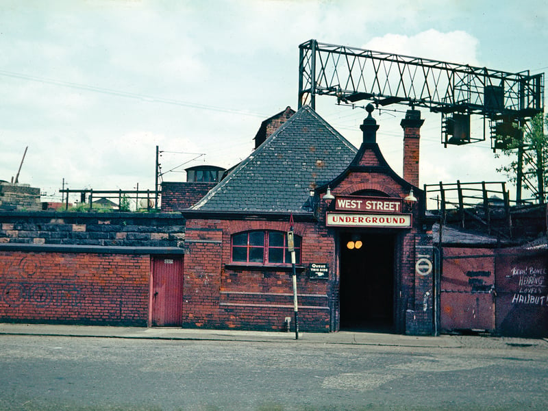 When the Glasgow Subway opened in 1896 most of its stations were entered
through the ground floors of tenements, but West Street was an exception. This surface building was the entrance.