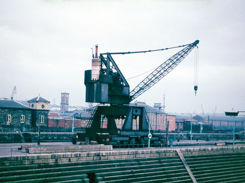 This photograph shows a steam crane in Govan Graving Docks during the 1960s. When the second Govan Graving Dock was opened in 1886, this steam crane was probably installed to serve both one and two docks. Shortly after this photograph was taken it was replaced by an electric crane