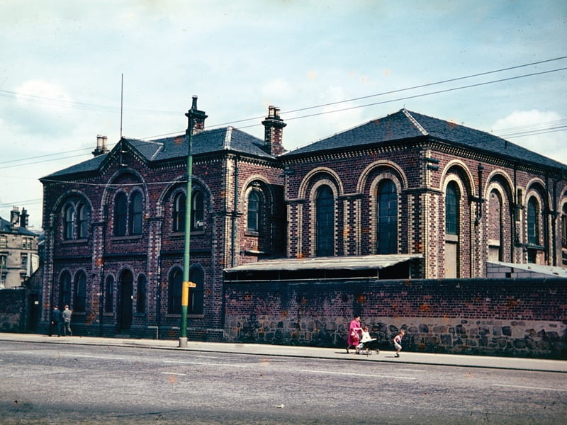 This image shows the offices and laboratories of the former Govan Iron Works on Crown Street in the mid-1960s. It was founded in the late 1830s as an iron-smelting works and closed in the late 1950s. This block, however, survived the demolition of the rest of the works for a few years
