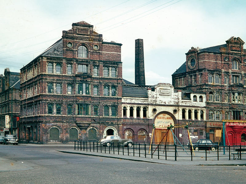 This is a photograph of the former clay tobacco pipe works on Bain Street. In the 19th century tobacco was generally smoked in clay pipes. This works made these pipes, by hand, which were fired in kilns sited between the two ranges of workshops, now demolished