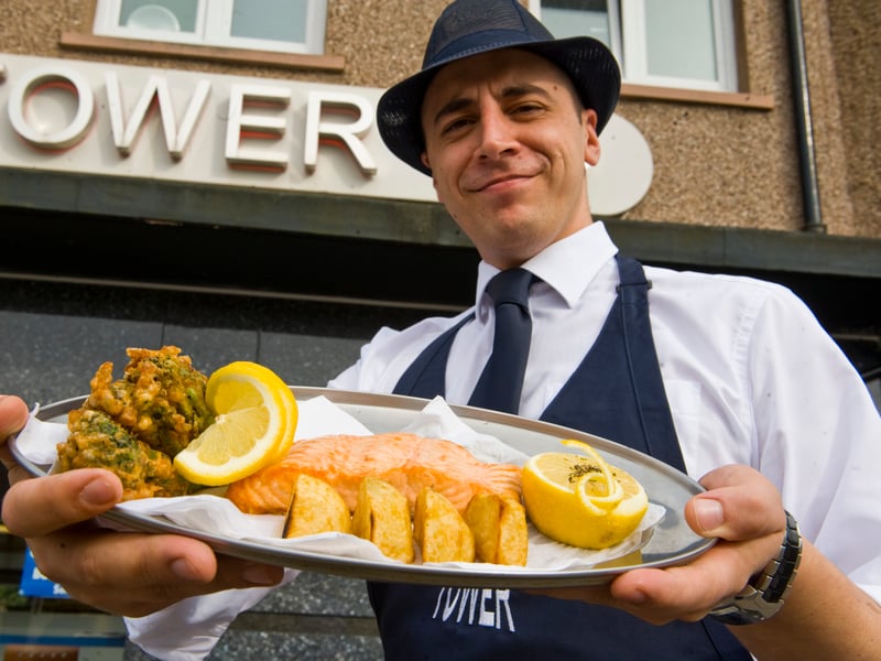 Domenico Pia, owner of The Tower chip shop in Penicuik, serves up oven-baked salmon, roast potatoes and deep-fried battered broccoli, in 2009