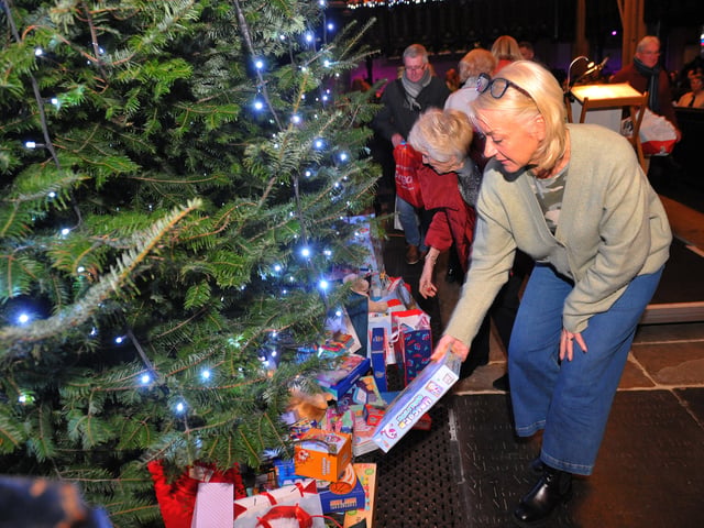 Generous readers placed presents under the tree for Cash For Kids Mission Christmas.