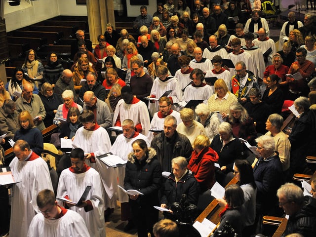 The Leeds Minster Choir walk through the majestic church at the start of the YEP's Christmas Carol Concert. 