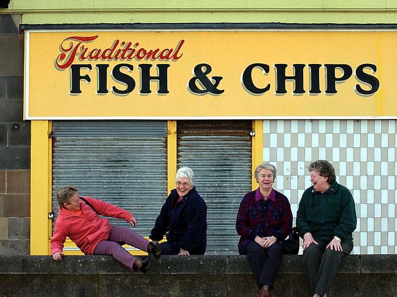 Portobello residents Joyce Keegan, Margaret Crozier, Carole Milne and Sheila Stevenson sit outside a fish and chip shop which is only open during the tourist season, in March 2002