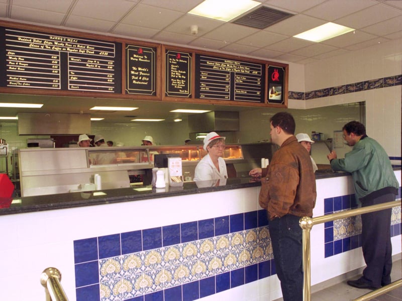 Customers wait to be served at the takeaway section of Harry Ramsden's restaurant/fish & chip shop at Newhaven in July 1993