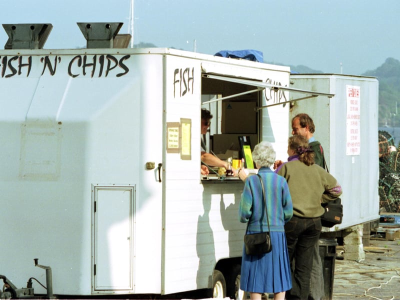 Customers at a fish and chip van on the quayside on the island of Mull in July 1992