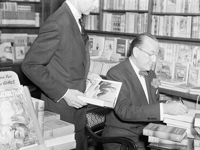 Noel Coward signing books at Jenners in April 1954.