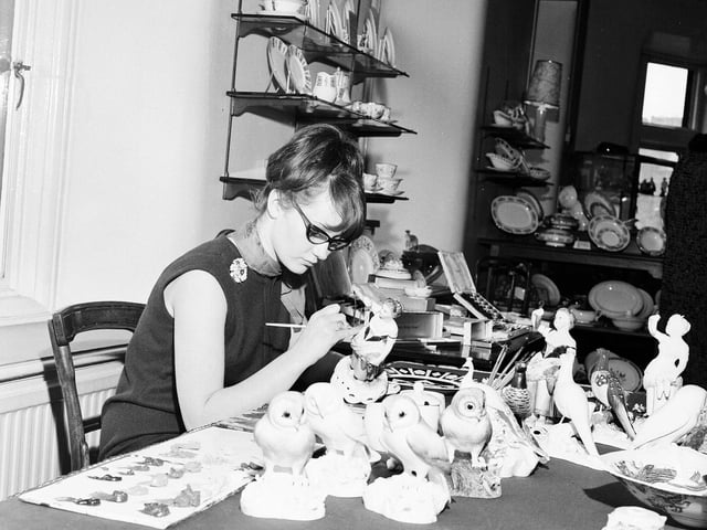 Christine Jackson working on a china figure in Jenners in May 1965.