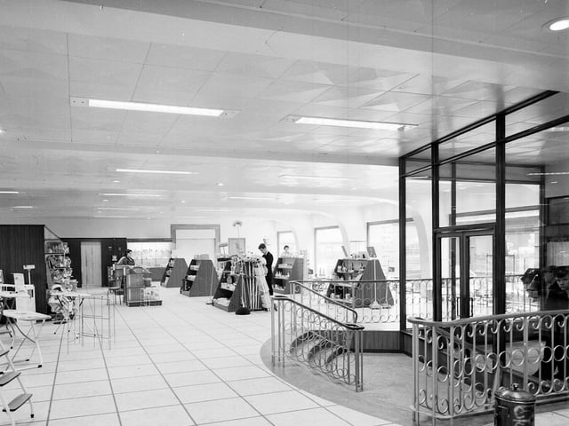 Setting up a new sales display in Jenners in October 1962.