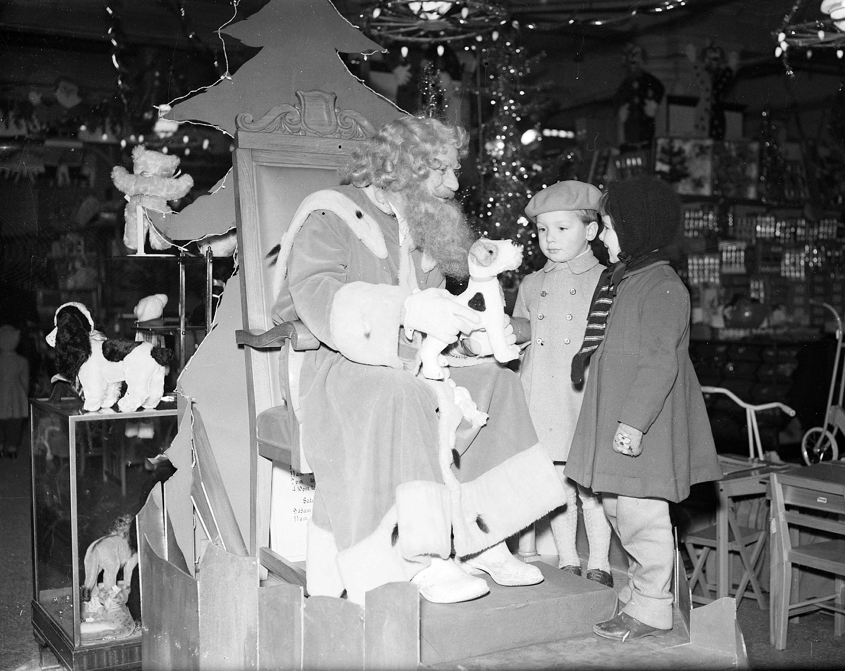 Santa Claus meets children at Jenners in December 1958.