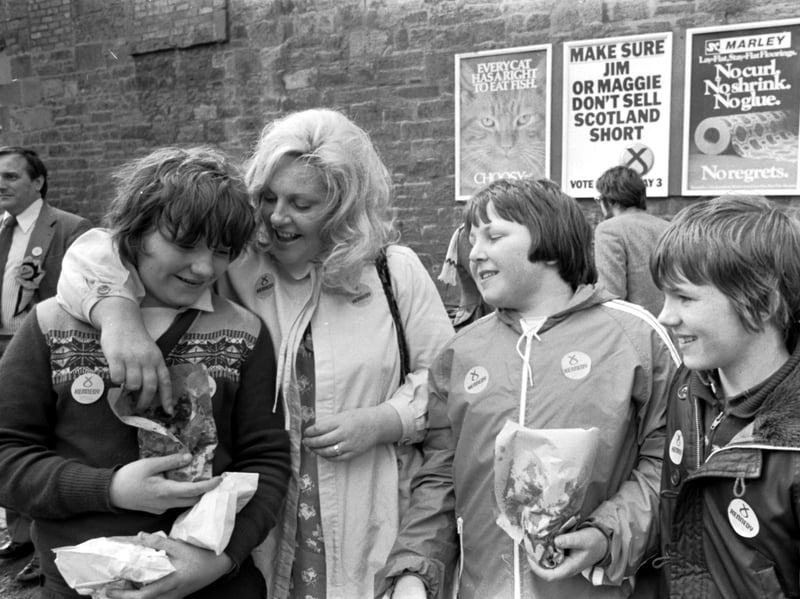 SNP politician Margo MacDonald gets a chip from local boys during her visit to Gorgie, Edinburgh, in April 1979