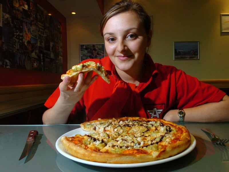 Anima pizzeria co-owner Emanuela Crolla with the fish and chips pizza in November 2007