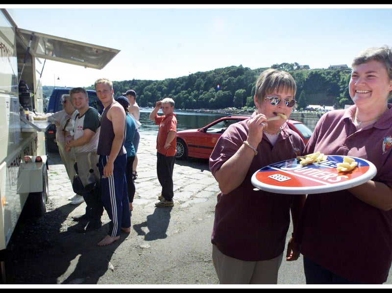 The Fisherman's Pier Fish and Chip Van owners Jane MacLean (right) and Jeanette Gallagher with their Les Routiers award, given for the quality of their food, in the centre of Tobermory, on the Isle of Mull, in August 2002