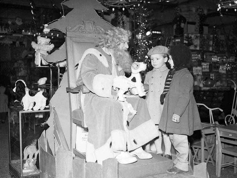 Two children meet Santa in Jenners in December 1958.