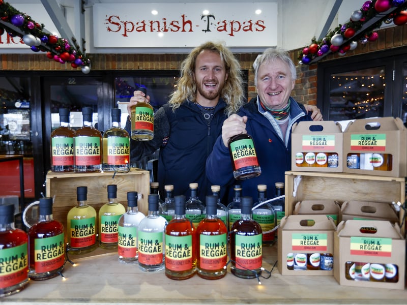 Will Smith and his father, Simon Smith on their Rum and Reggae stall. Simon Smith said, 'the whole idea came from the love of the music.' Picture: Chris Moorhouse (301125-19)