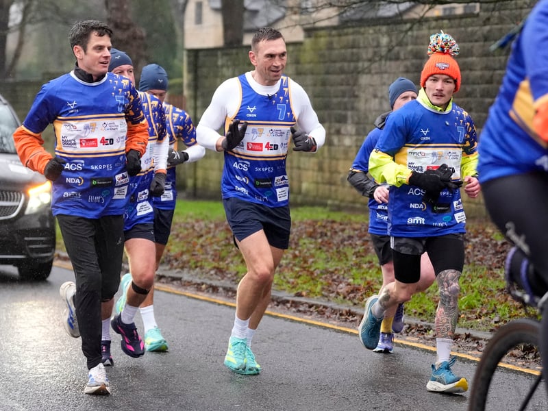 Kevin Sinfield (centre) is joined by Jonny Brownlee (left) and Josh Warrington (right) on his way to Headingley.