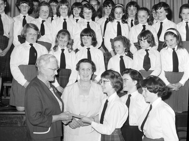 Dr E Baxendale accepts a £25 cheque for the Dalry House Appeal in June 1965.