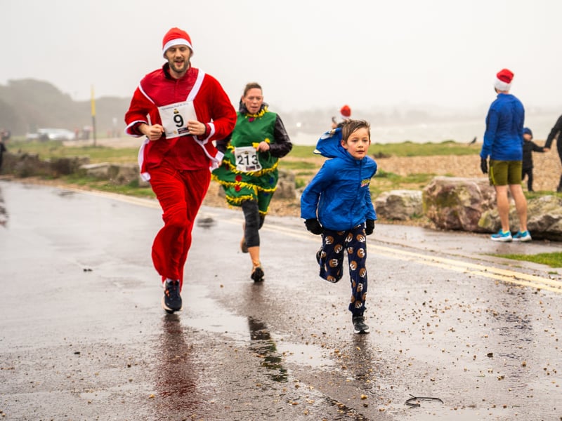 People braved the weather to take part in the Gosport Rotary Club's Christmas Pud 5k at Stokes Bay this weekend. 

Pictured: People taking part in the fun run. 


Picture: Alec Chapman