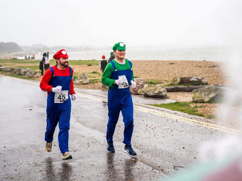 People braved the weather to take part in the Gosport Rotary Club's Christmas Pud 5k at Stokes Bay this weekend. 

Pictured: People taking part in the fun run. 


Picture: Alec Chapman