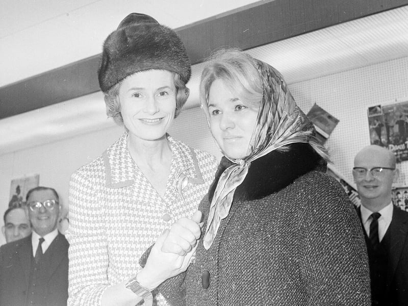 Lady Isobel Barnett congratulates the winner of a new 19" TV set at the opening of a Rediffusion showroom at Dalry Road in December 1964.