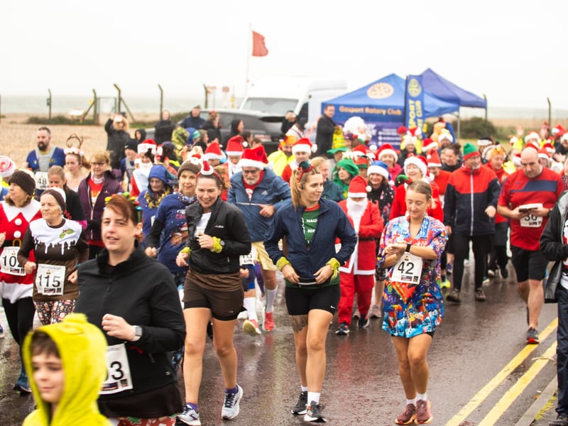 People braved the weather to take part in the Gosport Rotary Club's Christmas Pud 5k at Stokes Bay this weekend. 

Pictured: People taking part in the fun run. 


Picture: Alec Chapman