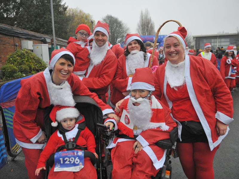 Happy Santas running for the Leeds Power Chair football club.