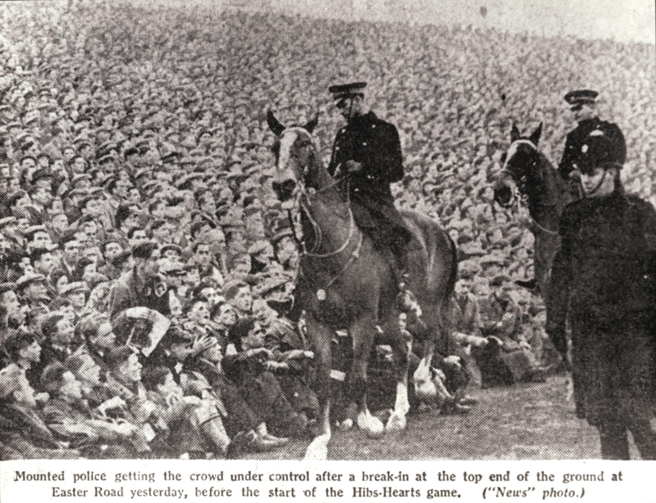 Mounted police keep an eye on the crowds at Easter Road during the Edinburgh derby Hibs v Hearts football match in January 1950. A record attendance of more than 65,000 fans saw Hearts win the match 1-2.