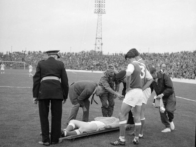 Hibernian's Willie Wilson is taken off on a stretcher with head wounds during a match against St Mirren at Easter Road in August 1959.