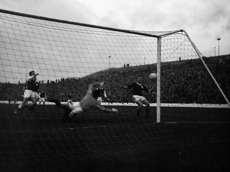 Martin of Dundee heads the ball onto the post against Hibs at Easter Road in November 1964.