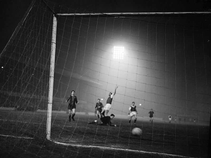 Jim Scott scores against Barcelona at Easter Road during a friendly in November 1962.