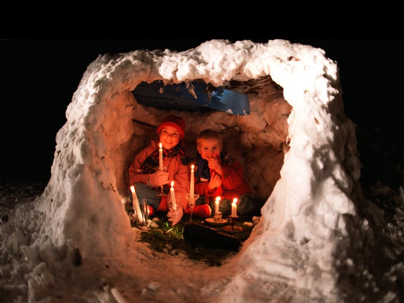 Laura Lindsay pictured and her brother Richard who built an igloo with their dad Andrew in the garden of their home.