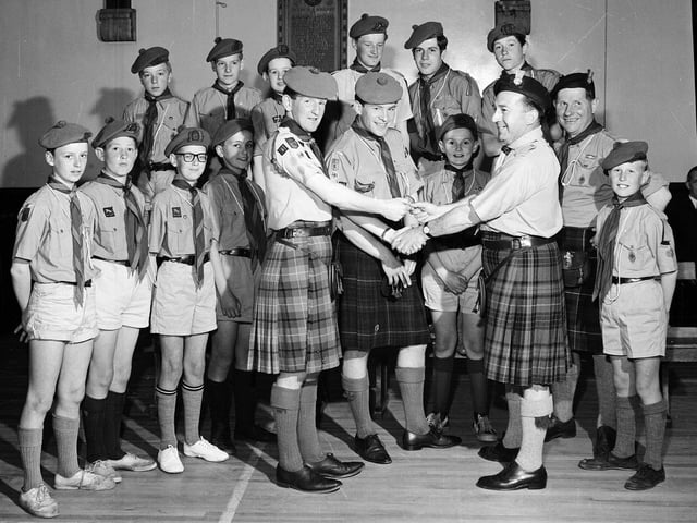 Gordon Sims presents Queen's Scout badges to scouts of the 111th Inverleith Troop in Inverleith Church Hall in June 1965.
