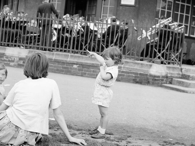 Children listed to a band in Inverleith Park in August 1963.