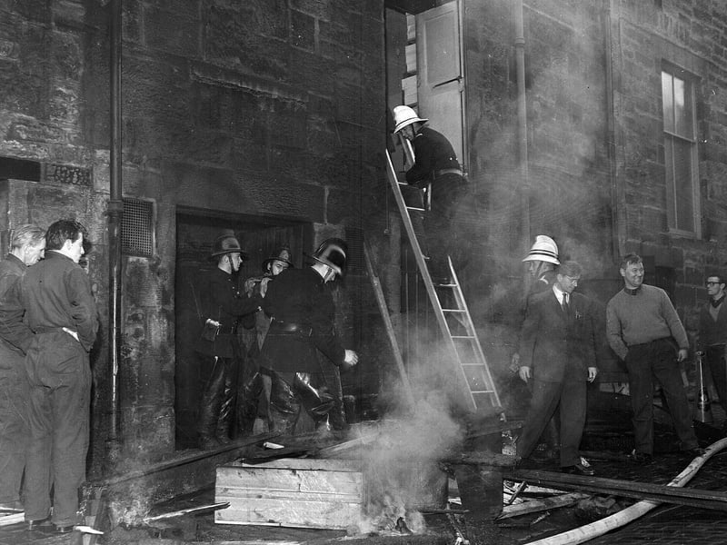Firemen tackle a blaze at Bell Donaldson in George Street in November 1962.