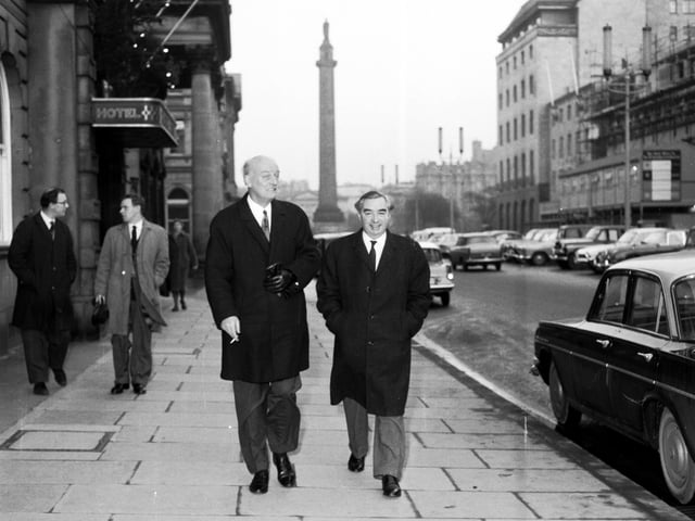 Labour MP George Brown walks along George Street with his brother-in-law in December 1965.