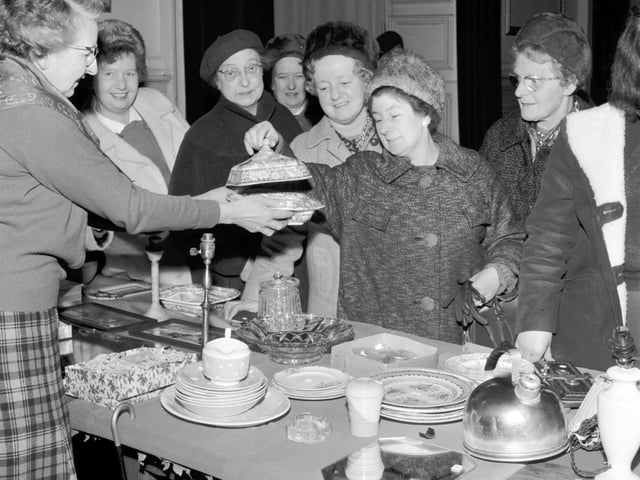 Ladies examine the goods for sale at the Christmas Fair held by the Edinburgh Council of Social Services in the Assembly Rooms, George Street, in December 1965.