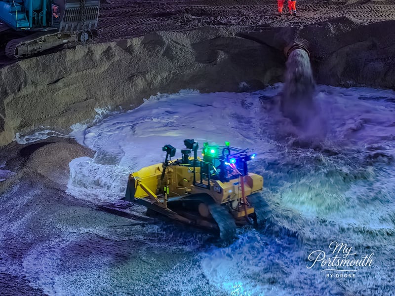 Shingle is pumped onto the beach at Southsea to help double its size