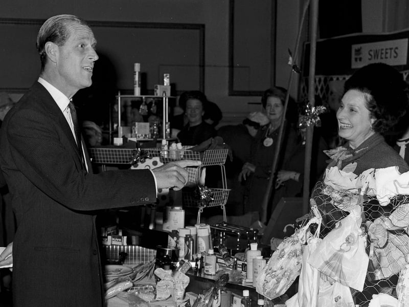 Prince Philip, the Duke of Edinburgh, attends the Christmas Market, held in the Assembly Rooms, George Street, in November 1965.