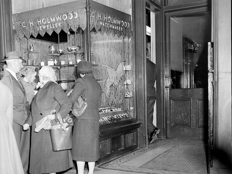 The aftermath of a smash and grab raid on CH Holmwood jewellers in George Street in October 1954.