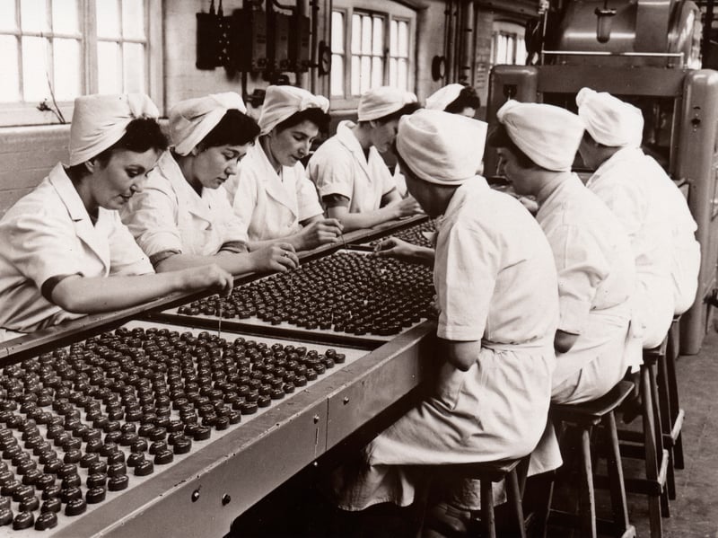 Workers decorate chocolates by hand at the Rowntree factory, York, in 1956