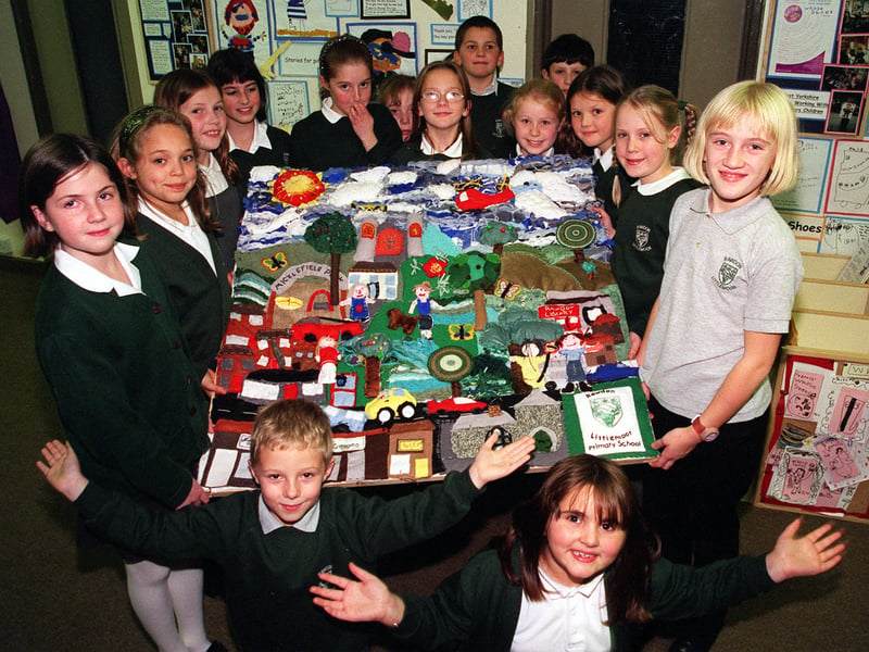 All our own work. Pupils from Rawdon Littlemoor Primary School with their panel of the Millennium Tapestry on show at the Elmete Professional Development Centre in November 1999.