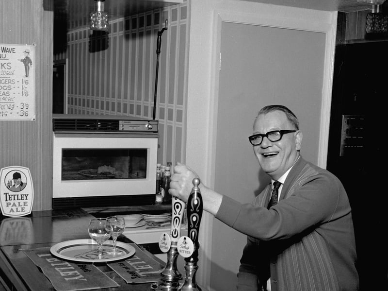 Pub landlord Jack Watson with his newly installed microwave oven at the Bull's Head in Mexborough, South Yorkshire, in 1968