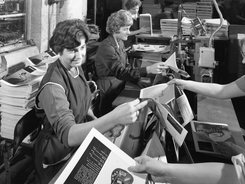Women working on a brochure for Selmer Guitars in the binding room at a printing company in Mexborough, South Yorkshire, in 1959