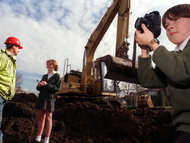 Rawdon Littlemoor Primary pupils Anna Blyth, left, and Ben Vardy interviewing one of the builders working at their school for their newspaper. Pictured in March 1999.