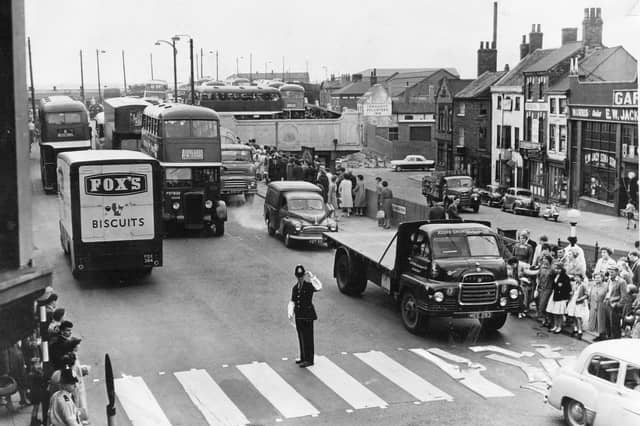 A police officer at a busy pedestrian crossing in Doncaster in July 1961, before the bypass was built