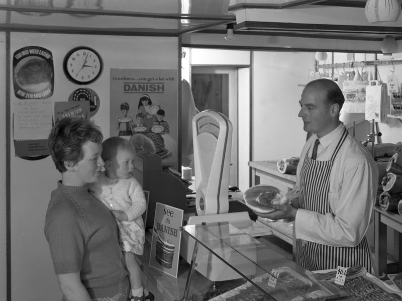 A mother and two children have the new metric system explained to them at a traditional butcher's shop in Stocksbridge, Sheffield, in 1966
