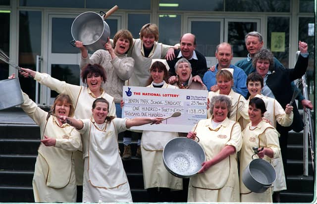 Some of the members of the Benton Park School lottery syndicate, pictured with their cheque for £138,153 in March 1998. Holding the cheque, centre, is lottery leader Christine Lawrence.