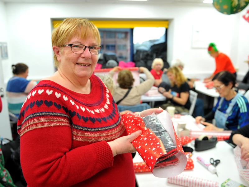 Sandra Hartley wrapping a present