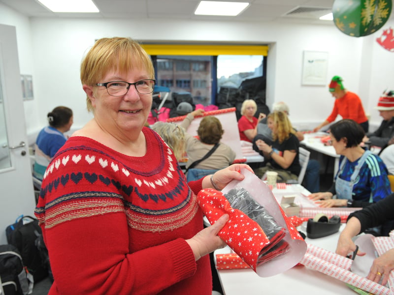 Sandra Hartley wrapping a present for the Homeless Street Angels, who will hand out 100 bags to the homeless on Christmas Eve containing presents and items.